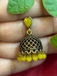 httpssnfancyworld.comwp-contentuploads202410Mehandi-Coloured-Jumka-with-Yellow-Pearl-Kundan-Stone.jpg