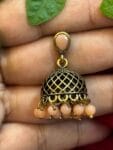 httpssnfancyworld.comwp-contentuploads202410Mehandi-Coloured-Jumka-with-Peach-Pearl-Kundan-Stone.jpg