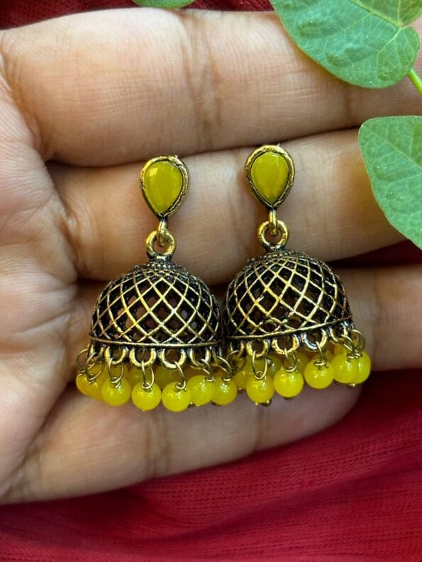 httpssnfancyworld.comwp contentuploads202410Mehandi Coloured Jumka with Yellow Pearl Kundan Stone